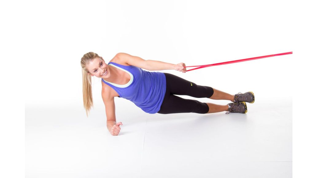 woman exercising with THERABAND