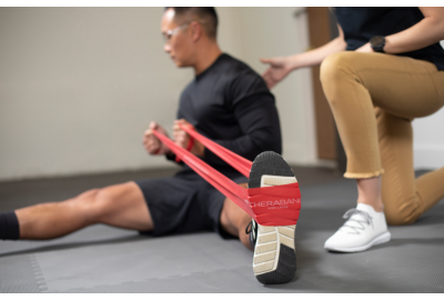 man stretching with THERABAND